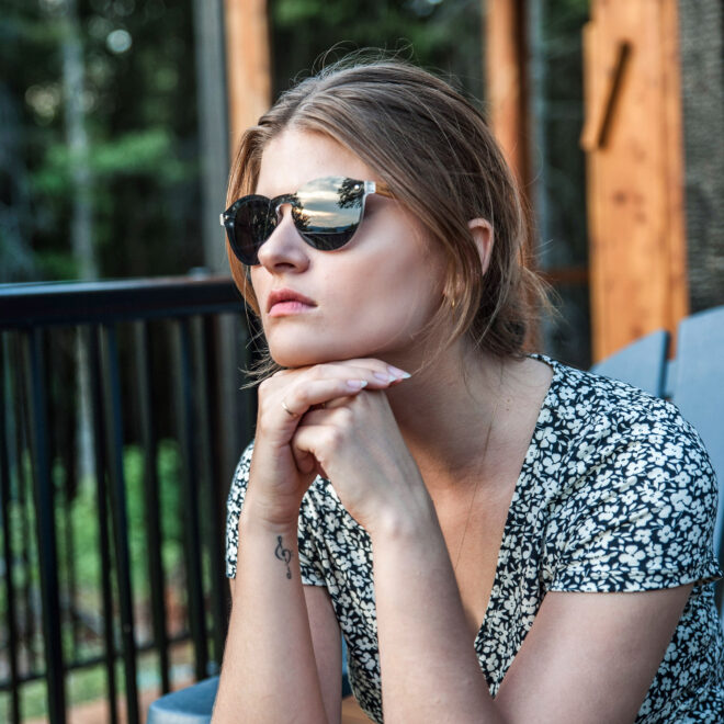 Round zebra wood sunglasses black polarized lenses on women
