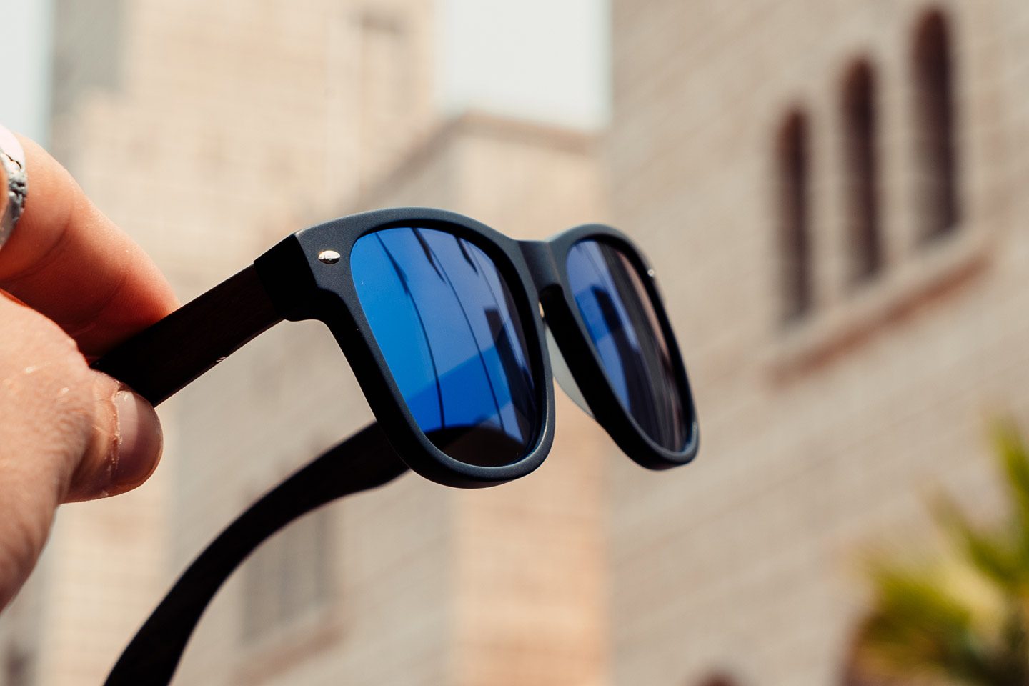 ebony wood classic style sunglasses blue lenses