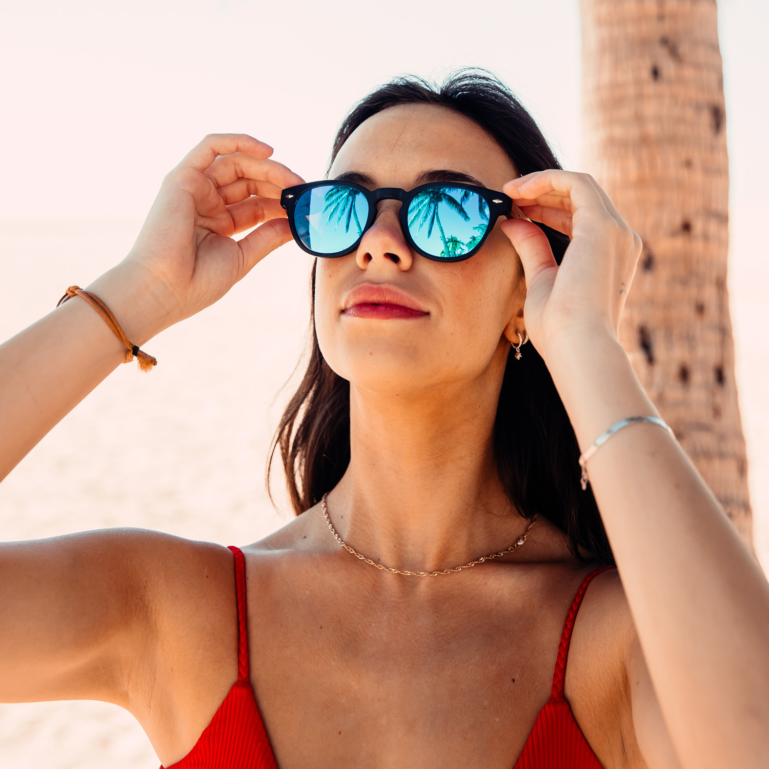 round walnut wood sunglasses blue mirrored lenses female model