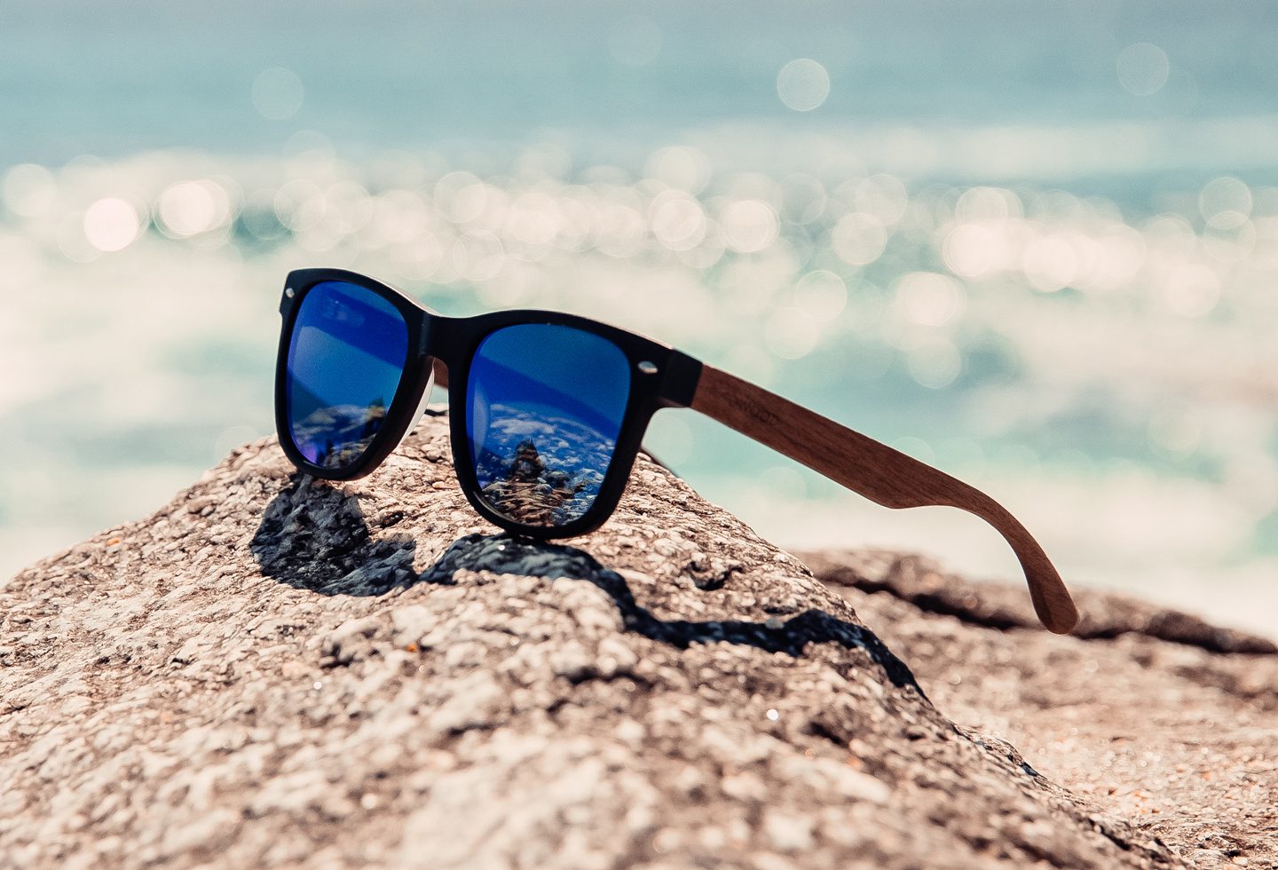 Walnut wood sunglasses with blue mirrored polarized lenses