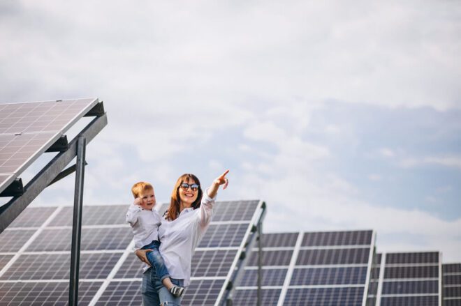 Family-using-solar-panels-to-generate-el