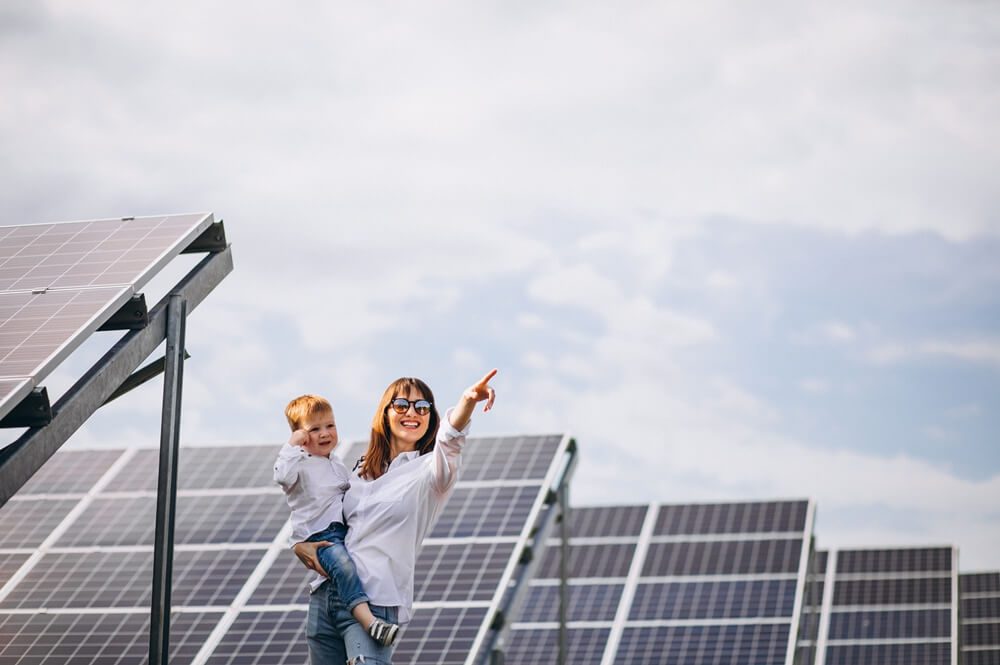 Family using solar panels to generate electricity. A way to reduce our carbon footprint