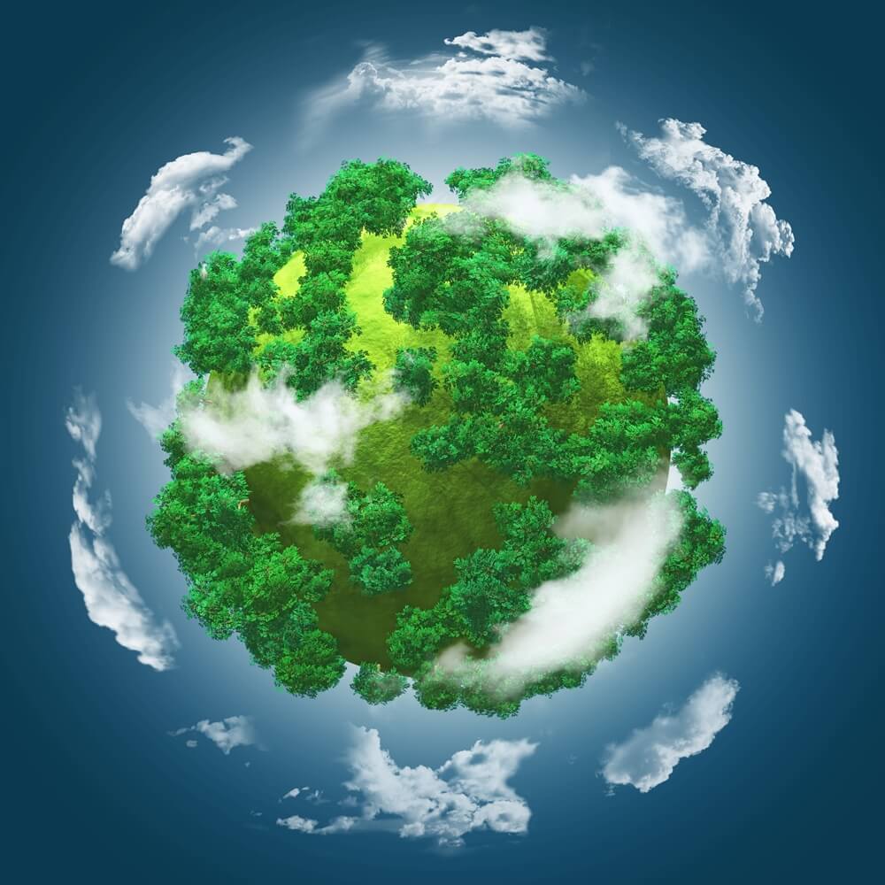 grassy globe with trees against a blue cloudy sky