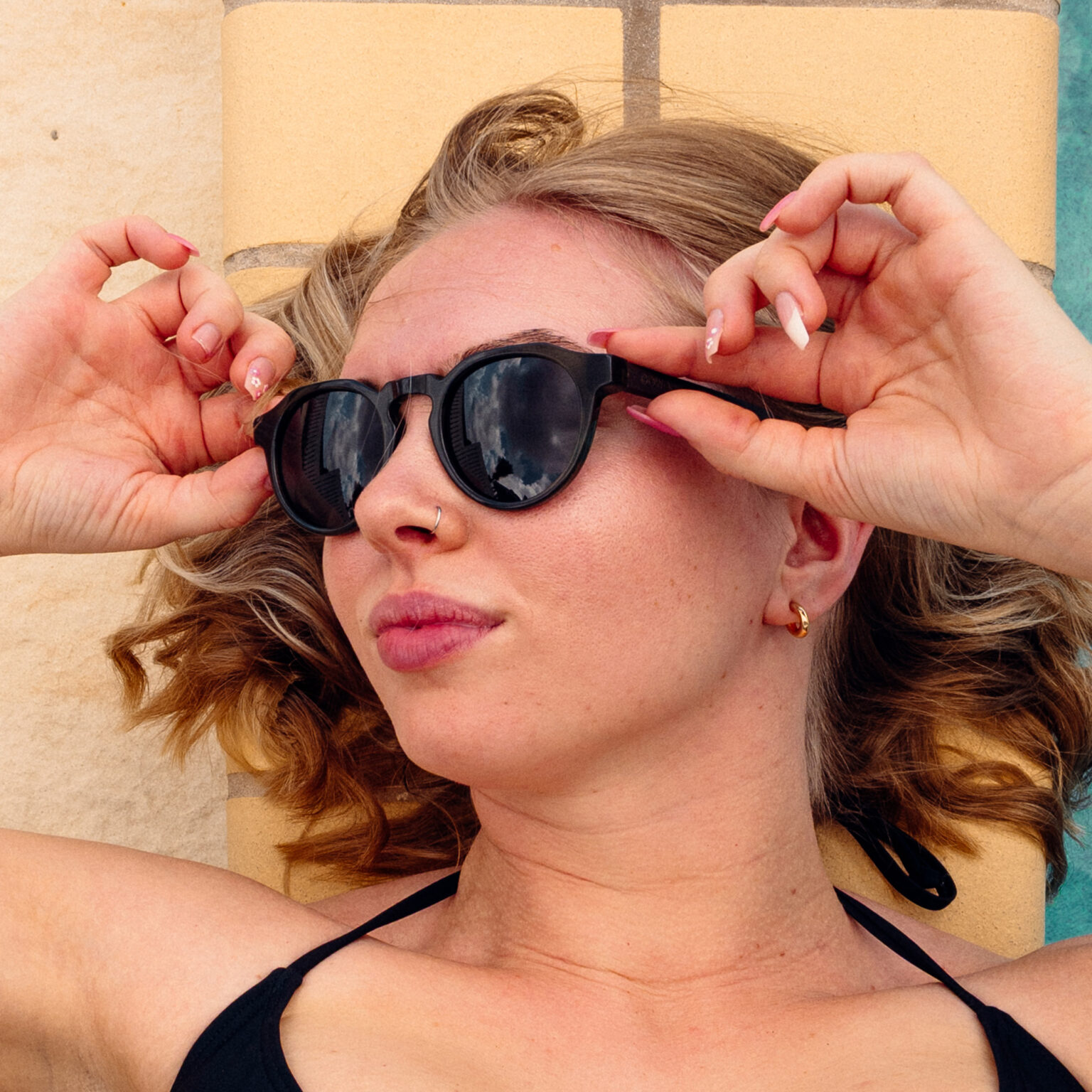 Panto round sunglasses with green transparent frame and ebony wooden temples.