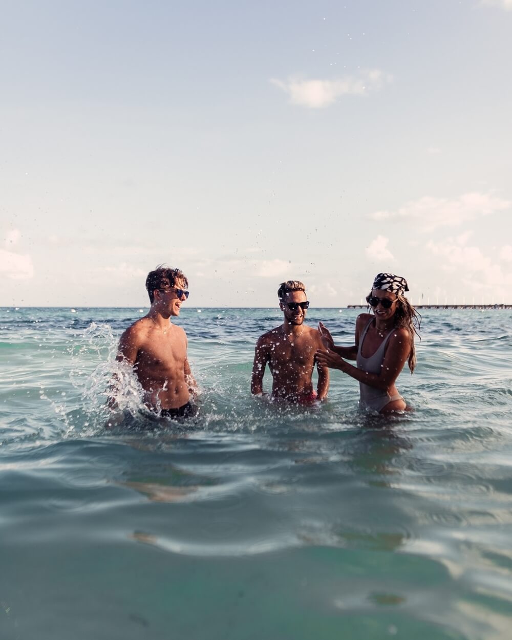 three friends at the beach wearing Gowood Wayfarer Walnut Wood Sunglasses with Mirrored Lenses